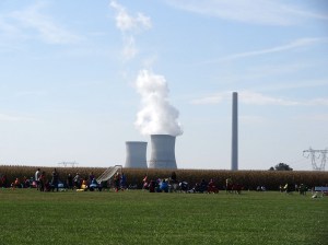 The field is on a farm next to the coal power plant.